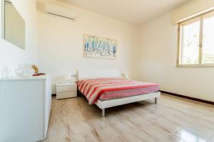Postel nebo postele na pokoji v ubytování Casa zio Masi