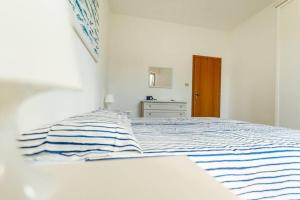 Postel nebo postele na pokoji v ubytování Casa zio Masi