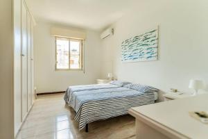 Postel nebo postele na pokoji v ubytování Casa zio Masi