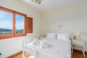 Postel nebo postele na pokoji v ubytování SUN VILLA GLYFADA