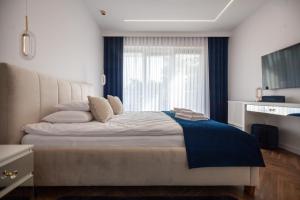 Postel nebo postele na pokoji v ubytování Apartament Leśny Taras z KLIMATYZACJĄ & Garaż podziemny w cenie-728-828-835- Targi Kielce + 76 fotografií