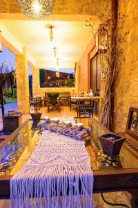 a living room with a glass floor with a table at Villa Mariellie in Néa Péramos
