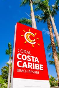 a sign for a coral costa carribean beach resort at Coral Costa Caribe Beach Resort - All Inclusive in Juan Dolio