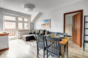 Posezení v ubytování Rentimi - Apartament Skandynawski 1 + 20 fotografií