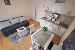 an overhead view of a kitchen and a living room at Vila Vrnjački Raj in Vrnjačka Banja
