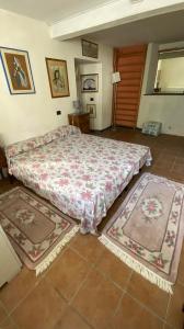En eller flere senger på et rom på Villa Molinazzo