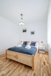 Posteľ alebo postele v izbe v ubytovaní APARTAMENT RODZINNY