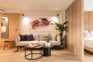 Posteľ alebo postele v izbe v ubytovaní Puerta Catedral Suites