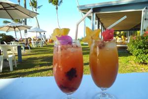 two drinks are sitting on a table at Are Tamareni River Studio in Avarua