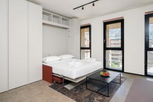 Postel nebo postele na pokoji v ubytování Swiss Hotel Apartments - Lugano