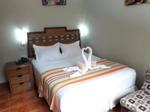 Voodi või voodid majutusasutuse Hostal Vista Waynapata 123 toas