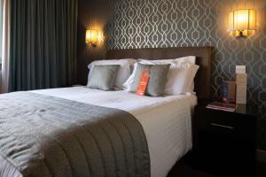 Postel nebo postele na pokoji v ubytování The Lincoln Hotel