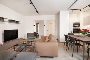 TV a/nebo společenská místnost v ubytování Swiss Hotel Apartments - Lugano