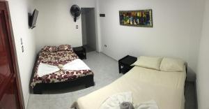 Ένα ή περισσότερα κρεβάτια σε δωμάτιο στο Hotel Inmaculada Real