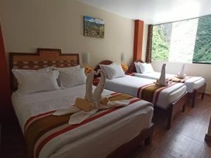 Voodi või voodid majutusasutuse Hostal Vista Waynapata 123 toas