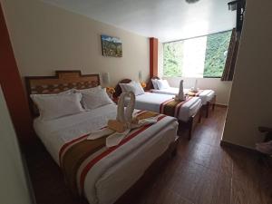 Voodi või voodid majutusasutuse Hostal Vista Waynapata 123 toas
