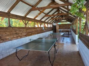 a room with two ping pong tables in it at Cabañas Atahualpa in Pica