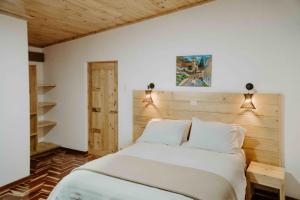 En eller flere senge i et værelse på Atusparia Guest House Huaraz