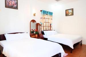 Voodi või voodid majutusasutuse Bungalow Hà Thu toas