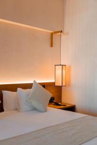 Postel nebo postele na pokoji v ubytování Hive Cancun by G Hotels