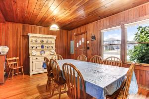 a dining room with a table and chairs at Oceanfront Beach House in Fernandina Beach