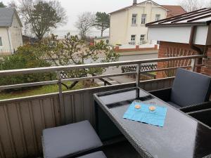 Balkón nebo terasa v ubytování Amrumer Schatztruhe mit Loggia und Meerblick + 7 fotografií