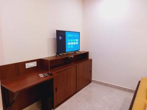 TV a/nebo společenská místnost v ubytování Chippy Residency