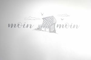 an illustration of a rocking chair in the sand at Ferienwohnung Spiekeroog in Neuharlingersiel +9 photos