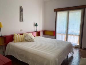 A bed or beds in a room at La Casa di Paola