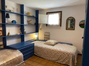 A bed or beds in a room at La Casa di Paola