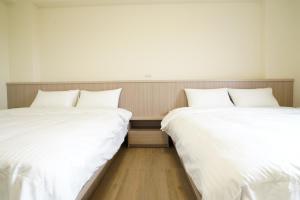 Postel nebo postele na pokoji v ubytování 享悅電梯民宿