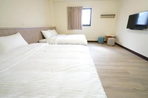 Postel nebo postele na pokoji v ubytování 享悅電梯民宿