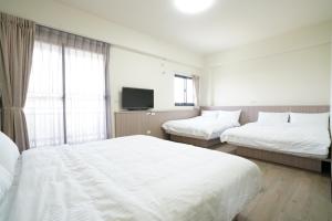 Postel nebo postele na pokoji v ubytování 享悅電梯民宿