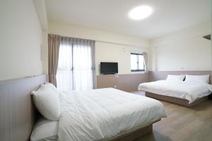 Postel nebo postele na pokoji v ubytování 享悅電梯民宿