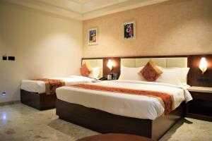 Hotel The Grand Chittor, Chittorgarh客房内的一张或多张床位