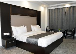Postel nebo postele na pokoji v ubytování Hotel Anand Empire Near New Delhi Railway Station