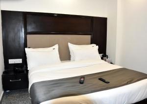 Postel nebo postele na pokoji v ubytování Hotel Anand Empire Near New Delhi Railway Station