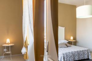 Postel nebo postele na pokoji v ubytování Il 49 Rooms Noto
