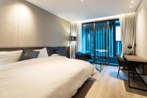 Postel nebo postele na pokoji v ubytování Hotel SoulHada