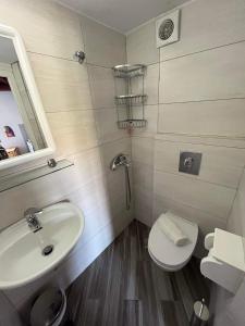 a bathroom with a sink and a toilet at Mykonian beauty(beach spot) in Platis Yialos Mykonos