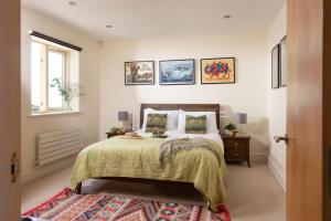 a bedroom with a bed and a window at 5 The Vista, Newquay in Newquay