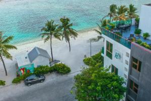 an aerial view of a building and the beach at h78 in Hulhumale