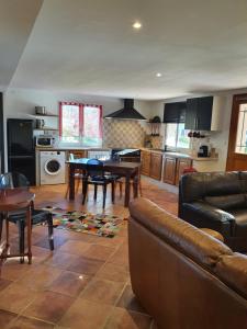 a living room with a couch and a table at Appartement Appietto in Appietto