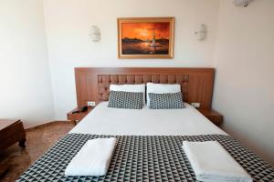 Postel nebo postele na pokoji v ubytování Kristal Beach Hotel