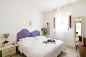 A bed or beds in a room at Trullo Fragno by Wonderful Italy
