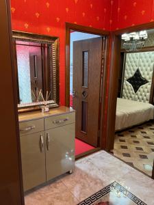 a bathroom with a vanity and a mirror at Apartment Tashkent , апартаменты Ташкент in Tashkent