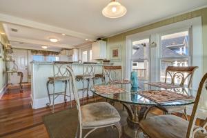 a dining room with a table and chairs at Rustic Oceanfront Cottage in Fernandina Beach