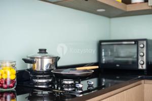Kuchyň nebo kuchyňský kout v ubytování Soleil by Kozystay - Kemang
