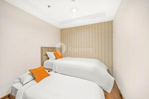 Postel nebo postele na pokoji v ubytování Soleil by Kozystay - Kemang