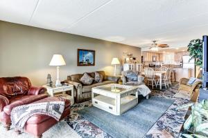 a living room with a couch and a table at Fresh Oceanfront Condo in Fernandina Beach